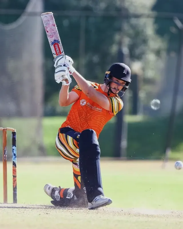 Riley Norton plaing cricket