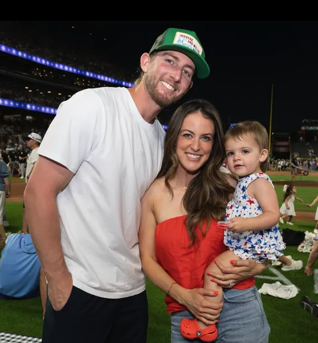 Ryan McMahon with wife and kid