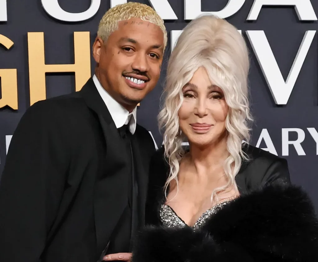 Alexander Edwards and Cher attend