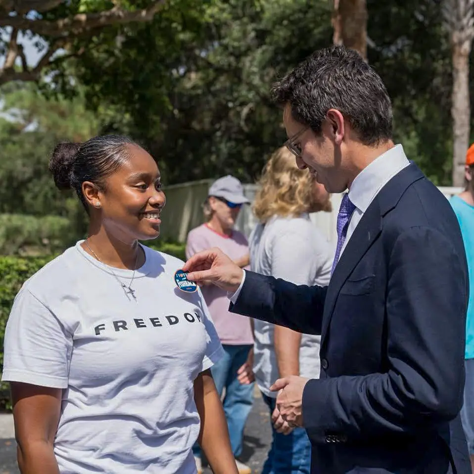James Fishback pinned by a supporter during a campaign event for the 2026 Florida gubernatorial election