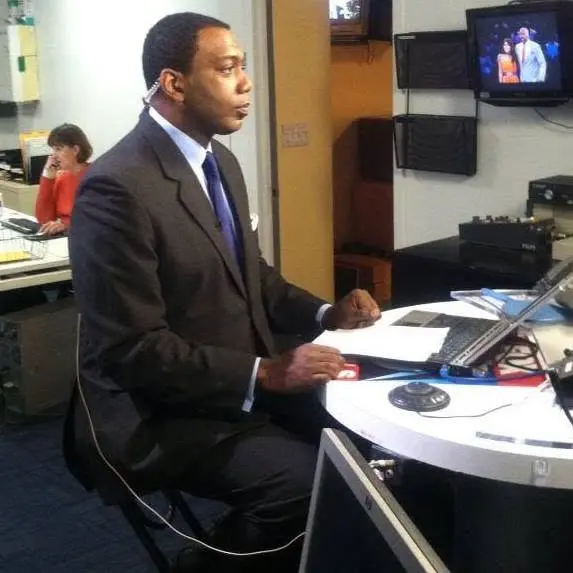 Basil A. Smikle Jr. On Set During a News Broadcast