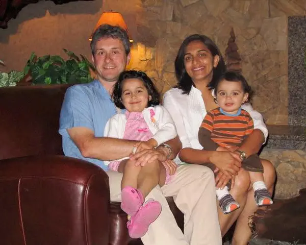 Karishma Manzur Posing for a Family Photo with Her Husband and Two Young Children