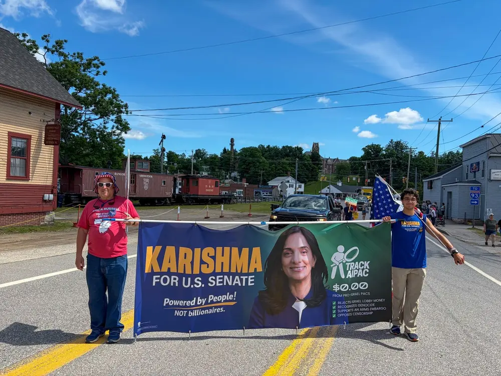 U.S. Senate candidate Karishma Manzur’s campaign banner on display during the Northfield-Tilton Old Home Day Parade in New Hampshire